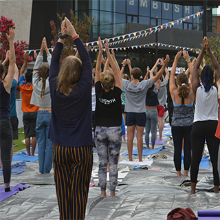 Group doing yoga outdoors